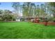 Beautiful home with a manicured lawn and blooming azaleas at 1691 Whitlock Rd, Marietta, GA 30066