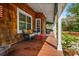 Inviting front porch with outdoor seating and cedar plank siding at 1691 Whitlock Rd, Marietta, GA 30066
