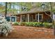 Charming front porch with seating and lush landscaping at 1691 Whitlock Rd, Marietta, GA 30066