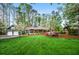 Beautiful home with lush lawn, flowering trees, and a detached garage, offering serene suburban living at 1691 Whitlock Rd, Marietta, GA 30066