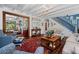Bright living room with stairway, comfortable seating, an area rug, and wood floors at 1691 Whitlock Rd, Marietta, GA 30066