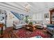Elegant living room with exposed beam ceilings, wood flooring, and cozy seating, offering a warm ambiance at 1691 Whitlock Rd, Marietta, GA 30066