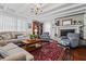 Inviting living room featuring a brick fireplace, comfortable seating, an area rug, and wood floors at 1691 Whitlock Rd, Marietta, GA 30066