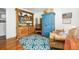 Comfortable living area featuring a blue rug, traditional cabinet and ample seating at 1691 Whitlock Rd, Marietta, GA 30066
