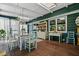 Screened porch with dining area, natural light and wood flooring at 1691 Whitlock Rd, Marietta, GA 30066
