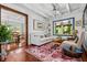 Comfortable sitting room featuring wood floors, natural light, and inviting furnishings at 1691 Whitlock Rd, Marietta, GA 30066