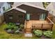 Aerial view of home with a wooden deck and landscaped backyard at 2001 Swazey Dr, Decatur, GA 30032