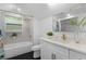 Well-lit bathroom featuring updated fixtures, tub and shower combo, and vanity at 2001 Swazey Dr, Decatur, GA 30032