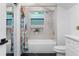 Charming bathroom featuring a tub and shower combo and colorful accents at 2001 Swazey Dr, Decatur, GA 30032