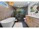 Bright bathroom showcasing double vanities, modern lighting, and a glass enclosed shower at 2001 Swazey Dr, Decatur, GA 30032