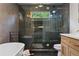 Modern bathroom features a soaking tub, glass enclosed shower, and contemporary fixtures at 2001 Swazey Dr, Decatur, GA 30032