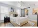 Bedroom featuring a modern bed frame, hardwood floors, and ensuite bath with sliding barn door at 2001 Swazey Dr, Decatur, GA 30032