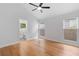 Bright, airy bedroom with hardwood floors and two windows, attached bathroom visible at 2001 Swazey Dr, Decatur, GA 30032