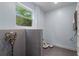 Dog wash station with tiled backsplash and vintage style sprayer in laundry room at 2001 Swazey Dr, Decatur, GA 30032