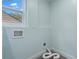 Bright laundry room with tile flooring, connections for washer and dryer, and small window at 2001 Swazey Dr, Decatur, GA 30032