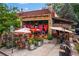 Charming restaurant exterior featuring a cozy patio with ample seating and inviting decor at 2001 Swazey Dr, Decatur, GA 30032
