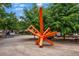 Artistic sculpture in the town park, creating a focal point surrounded by lush greenery at 2001 Swazey Dr, Decatur, GA 30032