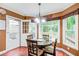 View of breakfast nook with hardwood floors, a round table, and access to the deck at 1360 Stampmill Way, Lawrenceville, GA 30043