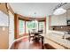 Cozy breakfast nook with a round table, bay window, and hardwood floors at 1360 Stampmill Way, Lawrenceville, GA 30043