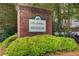 A brick sign identifies The Landing at Meadow Trace community at 1360 Stampmill Way, Lawrenceville, GA 30043