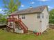 Backyard view showcasing a raised wooden deck, swing set, and patio at 1620 Cedar Hl, Douglasville, GA 30134