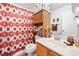 Bathroom featuring a shower/tub combination with wood accents and storage at 1620 Cedar Hl, Douglasville, GA 30134
