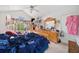Bedroom featuring a full bed, ceiling fan and large window for natural light at 1620 Cedar Hl, Douglasville, GA 30134