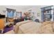 Bedroom with blue blinds, dresser, large bed, and cluttered decor at 1620 Cedar Hl, Douglasville, GA 30134