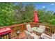 Back deck area perfect for entertaining and relaxing outdoors with a grill and seating at 1620 Cedar Hl, Douglasville, GA 30134