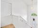 Bright hallway with white walls, staircase, and an arched window above the front door, creating a welcoming entrance at 1620 Cedar Hl, Douglasville, GA 30134