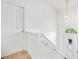 Bright hallway with white walls, stairs, and a decorative front door at 1620 Cedar Hl, Douglasville, GA 30134