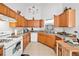 An ample kitchen with wooden cabinets and appliances at 1620 Cedar Hl, Douglasville, GA 30134