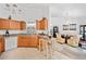 Bright kitchen with wooden cabinets and view of the dining room at 1620 Cedar Hl, Douglasville, GA 30134