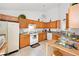 An ample kitchen with wooden cabinets and appliances at 1620 Cedar Hl, Douglasville, GA 30134