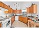 Bright kitchen featuring wooden cabinets and a corner sink at 1620 Cedar Hl, Douglasville, GA 30134