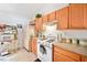 A traditional kitchen with wooden cabinets and a gas stove at 1620 Cedar Hl, Douglasville, GA 30134