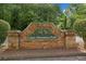 Stone monument sign with the text 'Cedar Mountain Park' surrounded by lush trees at 1620 Cedar Hl, Douglasville, GA 30134