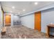 Basement space with concrete flooring and a walkout door at 3055 Henderson Mill Rd, Atlanta, GA 30341