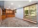 Spacious basement featuring built-in shelving and a sliding glass door to the outside at 3055 Henderson Mill Rd, Atlanta, GA 30341
