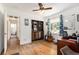 Bright bedroom with hardwood floors, a built-in bookshelf, and natural light from the window at 3055 Henderson Mill Rd, Atlanta, GA 30341