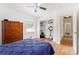 Bedroom with hardwood floors, a ceiling fan, and a built-in closet at 3055 Henderson Mill Rd, Atlanta, GA 30341