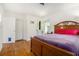 Bedroom featuring hardwood floors, natural light, and a cozy atmosphere at 3055 Henderson Mill Rd, Atlanta, GA 30341