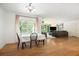 Open dining area with hardwood floors that leads to the living room and kitchen at 3055 Henderson Mill Rd, Atlanta, GA 30341