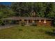 Charming brick ranch-style home with covered carport and a well-manicured front lawn at 3055 Henderson Mill Rd, Atlanta, GA 30341
