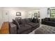 Cozy living room featuring hardwood floors, plush seating, and lots of natural light at 3055 Henderson Mill Rd, Atlanta, GA 30341