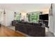 Spacious living room featuring hardwood floors, large windows, and neutral decor at 3055 Henderson Mill Rd, Atlanta, GA 30341