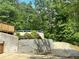 Backyard with a retaining wall, above ground pool and deck at 107 Oconnor Dr, Dallas, GA 30157