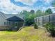 Backyard with covered porch and tall wooden fence at 107 Oconnor Dr, Dallas, GA 30157