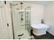 Clean bathroom featuring shiplap, a stand alone tub, glass shower, and modern fixtures at 107 Oconnor Dr, Dallas, GA 30157
