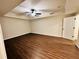 Large bedroom featuring vinyl wood floors, bright natural light, and a tray ceiling at 107 Oconnor Dr, Dallas, GA 30157